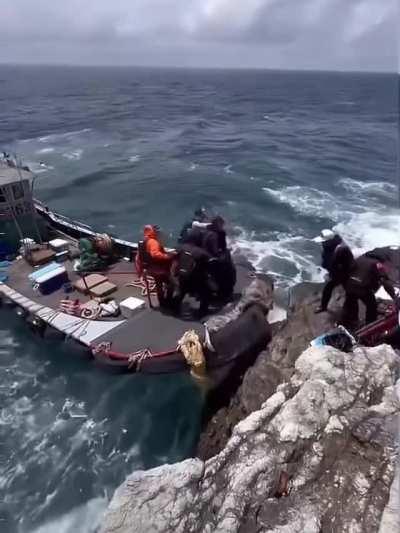 Cliffside boarding in 10ft seas