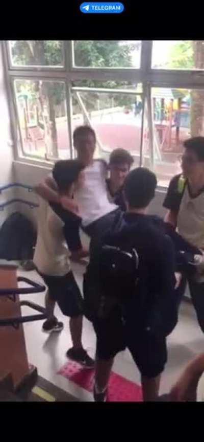 Teenagers throwing their friend a little too hard