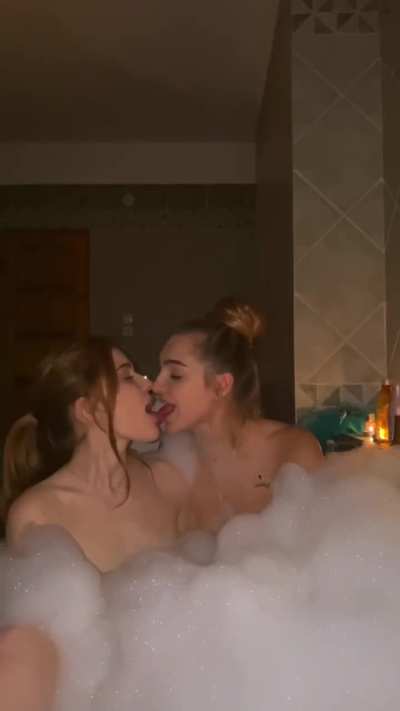 Hot lesbians kissing in the hot tub