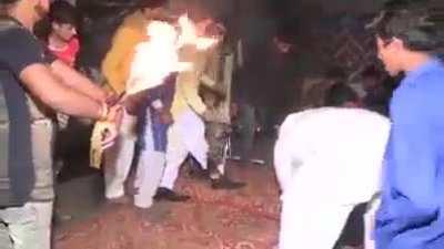 Dancing with hands on fire.