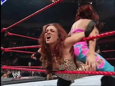 Melina stretching Maria in the ropes