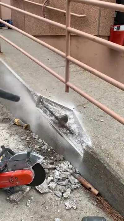 Concrete repair work. I love watching someone who has mastered his trade.