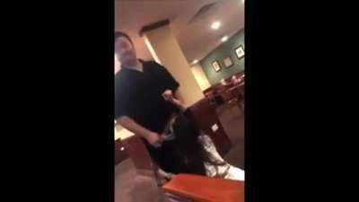 A waiter gets a blowjob inside of a restaurant