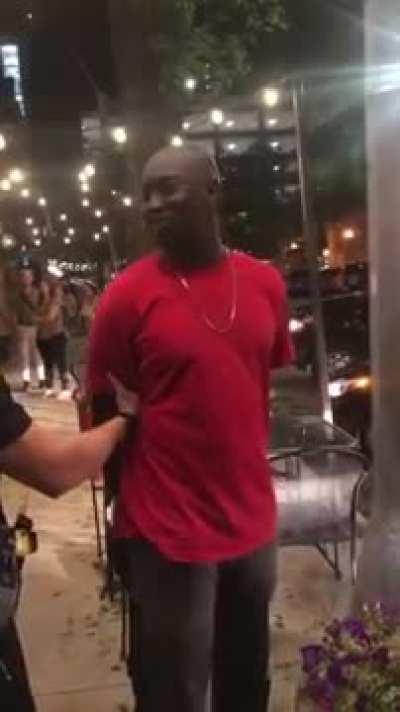 While the police arrest the black man, he learns he is an FBI agent.