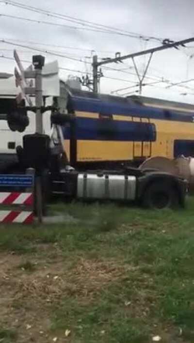 Netherlands - truck with rolls of paper vs train