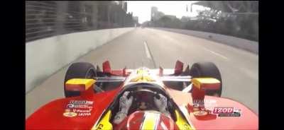 Tony Kanaan flies over Helio Castroneves