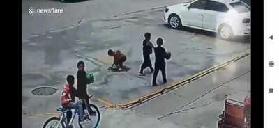WCGW throwing a firecracker into a manhole