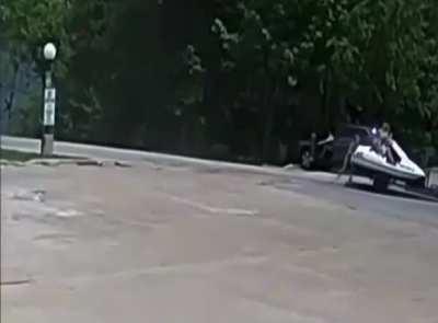 Riding on top of a jet skis as they're being towed