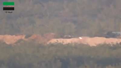 FSA 13th Division BGM-71 TOW strike on a Syrian Army tank turret peeking from behind a berm - Morek - 8/13/2014