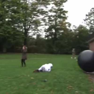 Guy jumped on an exercise ball from the terrace Warning