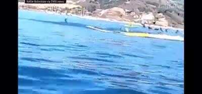 Whale swallowing canoe with people on board...