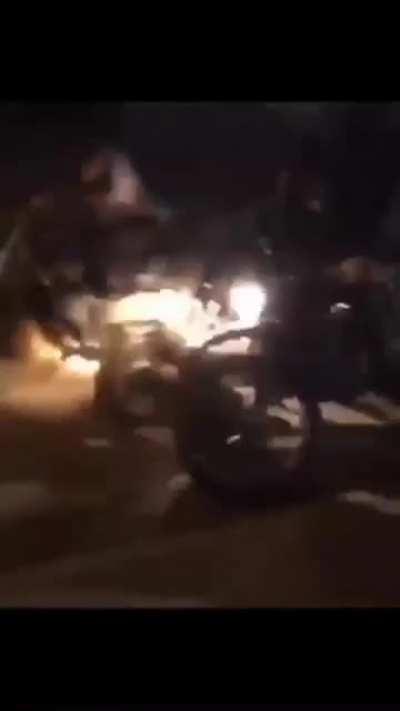 Someone booby trapped the road in Masshad and filmed Basijis falling.