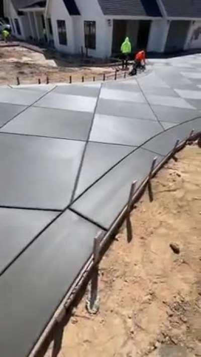 Freshly poured diamond-pattern driveway