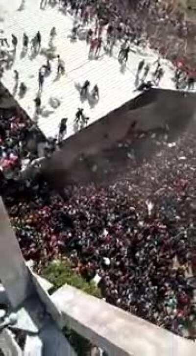 Aerial view of stampede for Palliatives stored in a warehouse in Jos, Plateau state. Cars lined for miles, engulfed in a sea of people, all clamouring to get their share. Hard to watch.