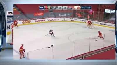 The Oilers broadcast switches to the Flames broadcast just in time to see Tkachuk fall over with the puck and cost an empty netter