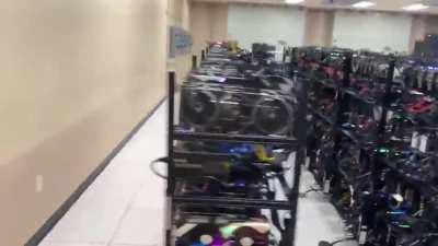 Mining rig someone bragged about on twitter, alnost all of those graphics cards are RTX 3070s, and this is room 1 of 4.
