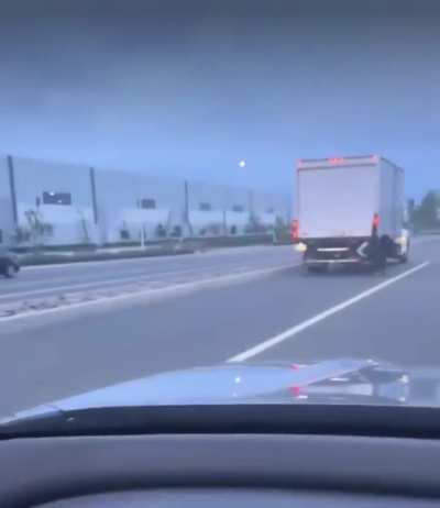 WCGW skater casually skitching at the back of a truck