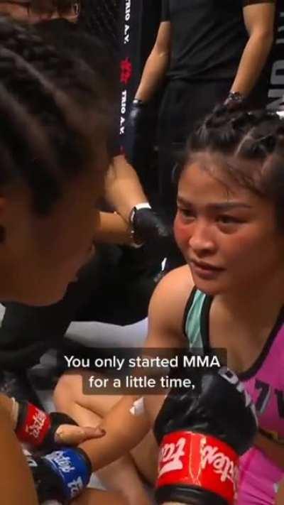 MMA Champion Angela Lee trying to make her opponent feel better after submitting her in a fight