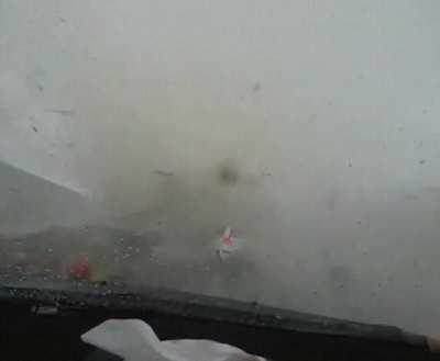 White car cuts off driver and gets swallowed by a tornado