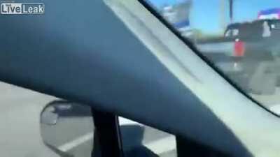 Another angle of the Trump train following Biden's bus