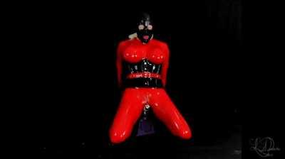 Rubber Gimp Caged and Riding