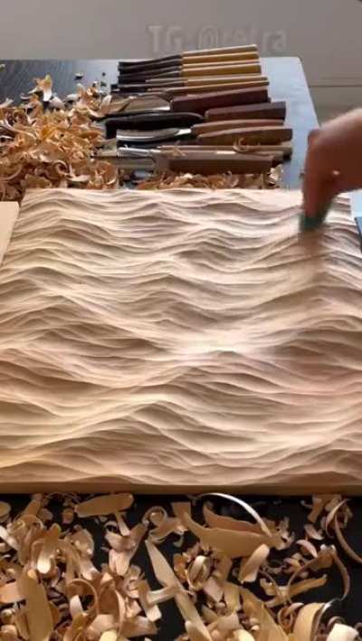 The artist turns wood into sea waves.