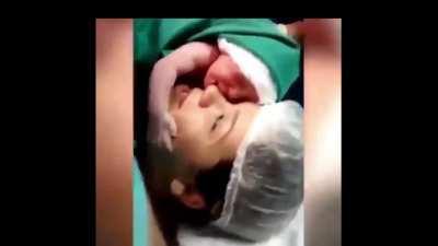 The newborn baby who doesn't want to leave his mother