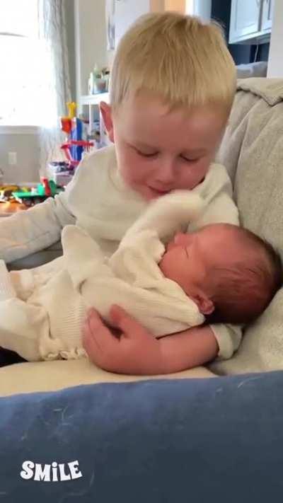 His reaction when he first held his new sibling is priceless.
