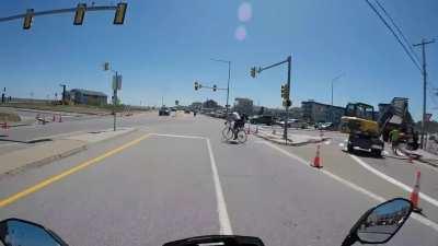 Old man bicyclist decides to take a left last second with no hand signal