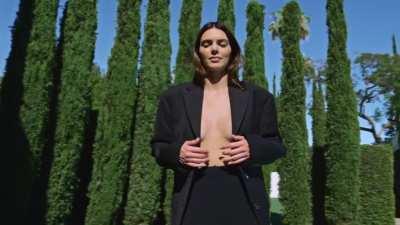 in black jacket + Jimmy Choo