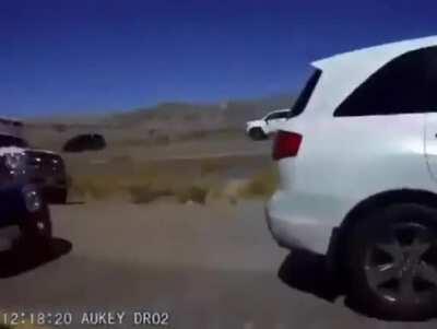 Ambulance yells at cars riding on shoulder of road