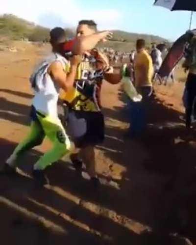 Let's stand in the middle of a road during a race!