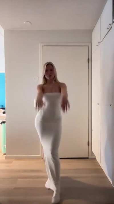 she knows how to move it in her white dress