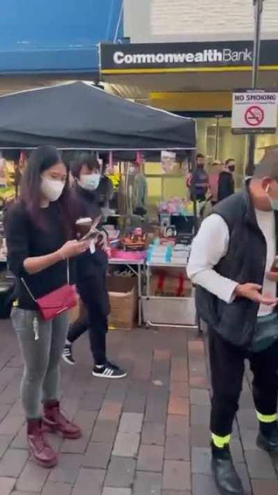 Drew Pavlou held a sign saying 