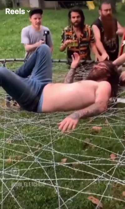 Jumping onto a barbed wire trampoline.