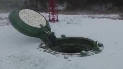 A Rocket getting launched out of a missile silo. (Turn down your volume)