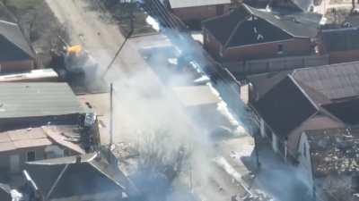 UA POV Newly released drone footage showing 2 Russian tanks being ambushed by Ukrainian forces, with one of the tanks being on fire and a smoking man jumping off. 2nd tank suffers an explosion too. Archival - February/March 2022, unknown location.