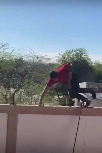Mexican soldiers push off a sicario off of wall
