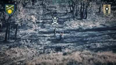 A russian walks up to and pokes an uxo of some kind with his foot, which has a predictable result. Filmed by the Ukrainian 66th Separate Mechanized Brigade.