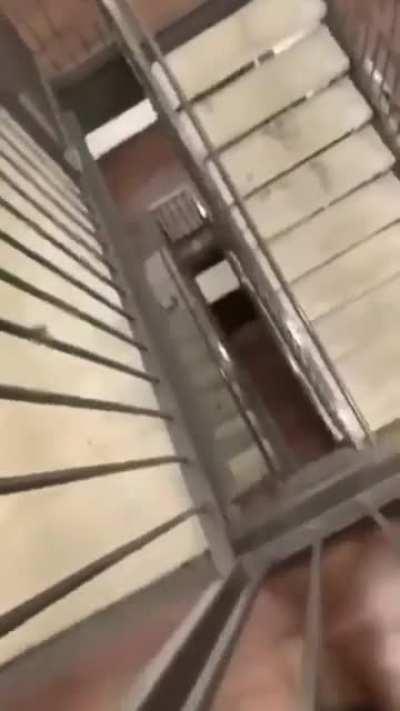 Sliding down a handrail that's multiple stories up