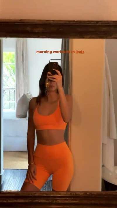 In orange workout clothes