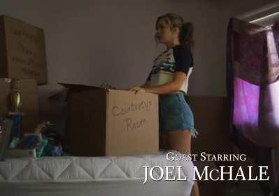 Brec wearing a crop top and jeans shorts in the Stargirl pilot