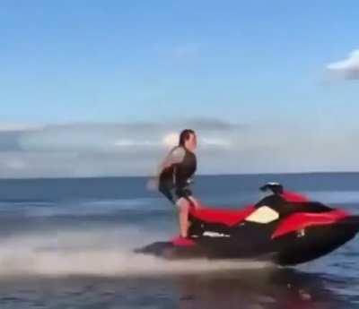 trying to do a backflip on a moving jet ski