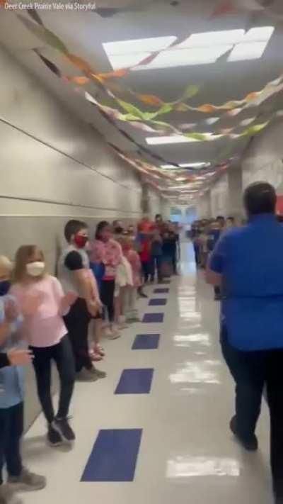 Students and staff at an Oklahoma elementary school lined the hallways to cheer for their school cafeteria manager who passed her test to become a U.S. citizen