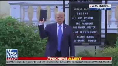 Deranged piece of shit holds up book he has never read, understood, followed or respected in a pathetic photo op to pander to his medieval base. Oh America what did you do?