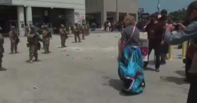 Protesters have appealed to the National Guard members all morning, urging them to remember their oath.