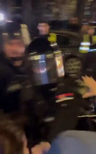 Cop freaking out on a girl during protest in Serbia