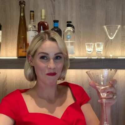 Claire Holt takes a drink