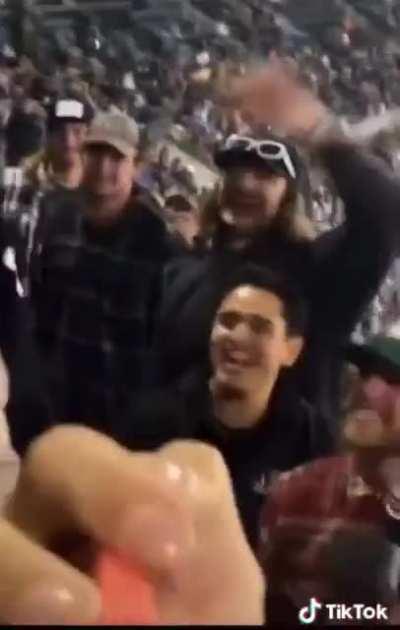 Woman Flashes her t*ts in a stadium. Mother gets mad as her kids saw the t*ts. Crowed throws beer on mad mother.