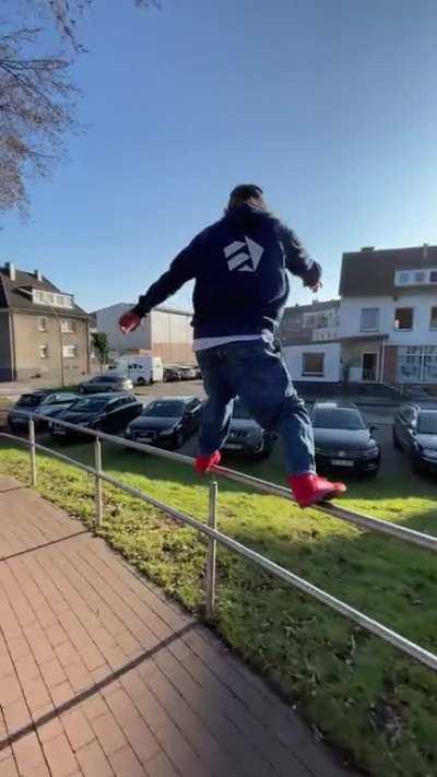 Framed perfectly sliding down a huge wavy rail on grindshoes